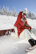 Photo: Young couple enjoying on snow Young couple enjoying on snow
