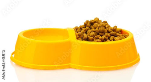 Photo: dry cat food and water in yellow bowl isolated on white dry cat food and water in yellow bowl isolated on white