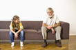 Girl looking at grandfather, smiling