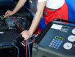 Motor mechanic working on engine bay with air handling unit