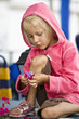 Girl playing with flowers