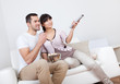 Young couple watching TV