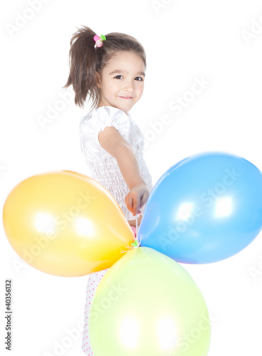 Foto: Little brunette girl with balloons in studio Little brunette girl with balloons in studio