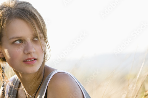 Photo: Mid adult woman smiling, close-up Mid adult woman smiling, close-up