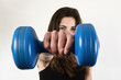 Photo: Young girl exercising with dumbbells Young girl exercising with dumbbells