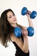 Photo: Young girl lifting weights Young girl lifting weights