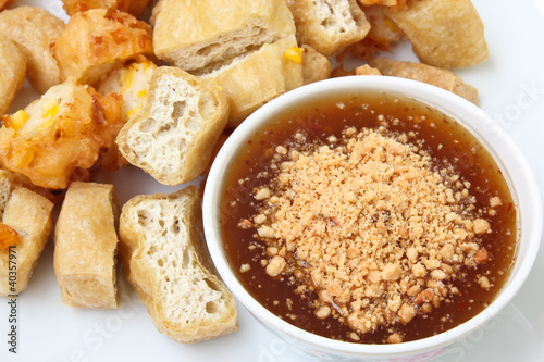Photo: Fried tofu and corn fritter with sauce Fried tofu and corn fritter with sauce