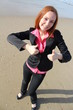 Thumbs up! - beautiful woman at the beach gesturing thumbs up