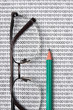 glasses and  pencil