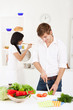 young couple in kitchen