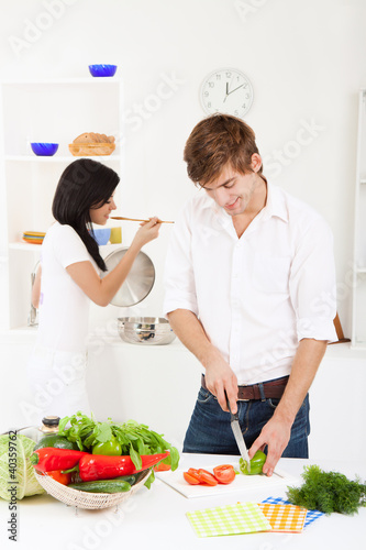 Photo: young couple in kitchen young couple in kitchen