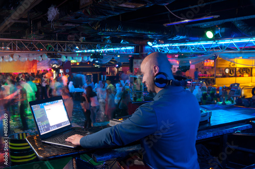 Photo: DJ behind the control panel DJ behind the control panel