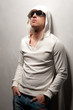 man with athletic standing near a wall