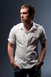 man with athletic standing near a wall