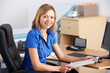Portrait UK doctor sitting at desk