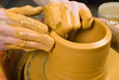 hands of a potter, creating an earthen jar of white clay hands of a potter, creating an earthen jar of white clay