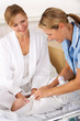 Nurse with mother and newborn baby
