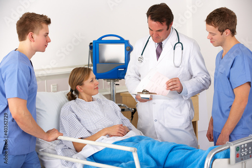 Photo: American medical team by patient's bed American medical team by patient's bed