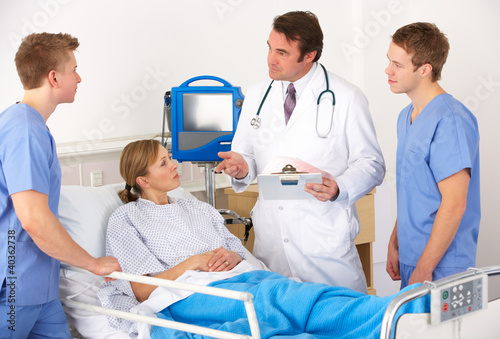 Photo: American medical team by patient's bed American medical team by patient's bed