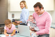 Family busy together in kitchen