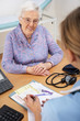 Senior woman patient with UK nurse