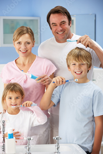 Photo: Family cleaning teeth together in bathroom Family cleaning teeth together in bathroom