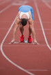 Sprinter in the starting blocks, ready to go