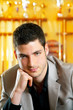 handsome man with suit sitting in billiard pool