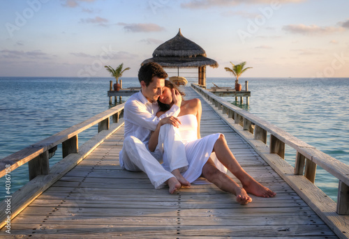 Photo: Sensual happy lovers in white clothes on the beach (Maldives) Sensual happy lovers in white clothes on the beach (Maldives)