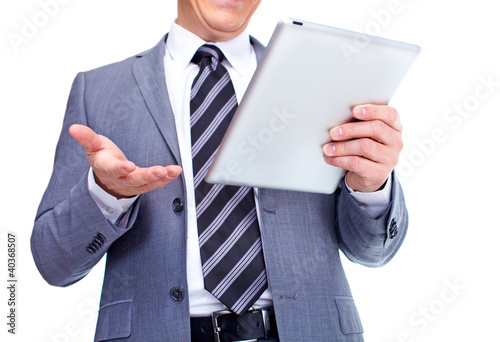 Foto: Hands of businessman with tablet computer. Hands of businessman with tablet computer.