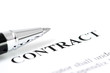 Close-up of silver pen on contract.