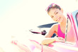 Happy free woman driving convertible car on road trip