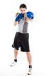 young boxer in gray shirt and blue boxing gloves