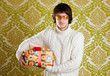 retro hip young man glasses holding  gift box