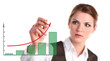 Photo: Young business woman drawing a graph showing growth Young business woman drawing a graph showing growth