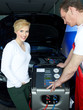 Motor mechanic working on engine bay with air handling unit