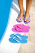 Female legs with colorful slippers