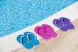 Colorful slippers by pool