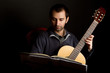 Guitar player studying Guitar player studying