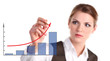 Photo: Young business woman drawing a graph showing growth Young business woman drawing a graph showing growth
