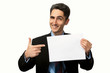 Photo: Young businessman is showing the advertisement Young businessman is showing the advertisement