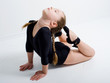 small pretty girl doing gymnastics over white background