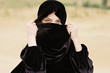 Woman covering face with hijab