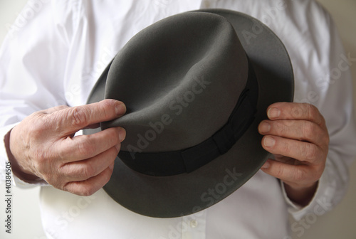 Photo: businessman with an old felt hat businessman with an old felt hat