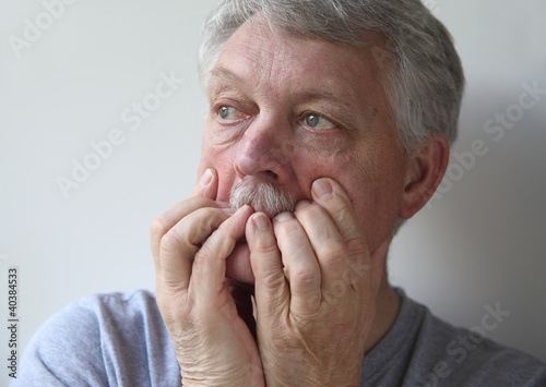 Photo: a senior with an anxious, fearful expression a senior with an anxious, fearful expression