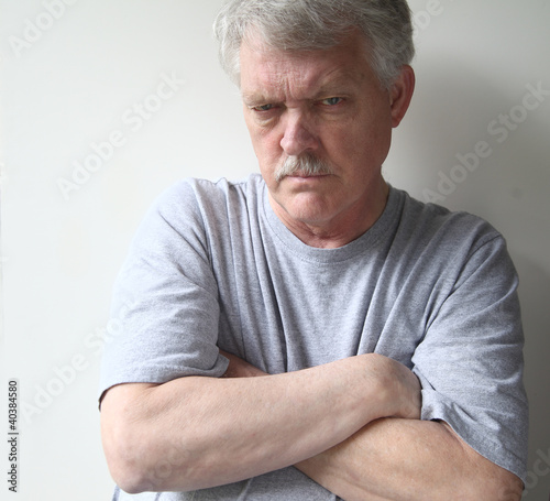 Photo: angry older man with his arms crossed angry older man with his arms crossed