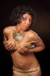 Burlesque dancer cupping her bra