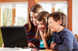2 girls and a boy at the laptop