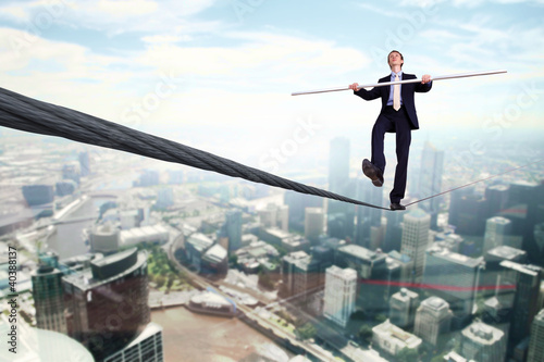 Foto: Business man balancing on the rope Business man balancing on the rope