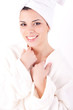 Beautiful healthy young brunette woman in a white spa bath robe